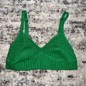 woman’s sweater tiny bra top